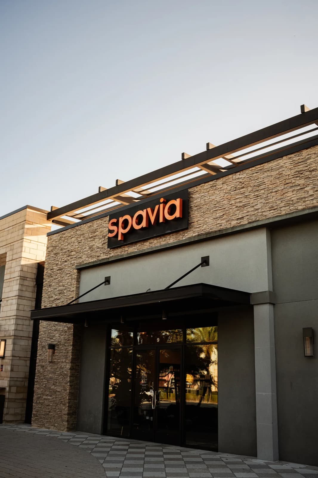 A Spavia day spa storefront at dusk